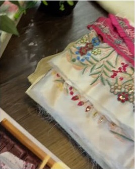 Embroidered fabric being unboxed