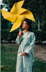 Powder blue suit with a yellow pinwheel