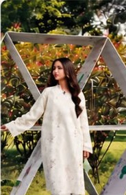 White lawn suit on a garden swing